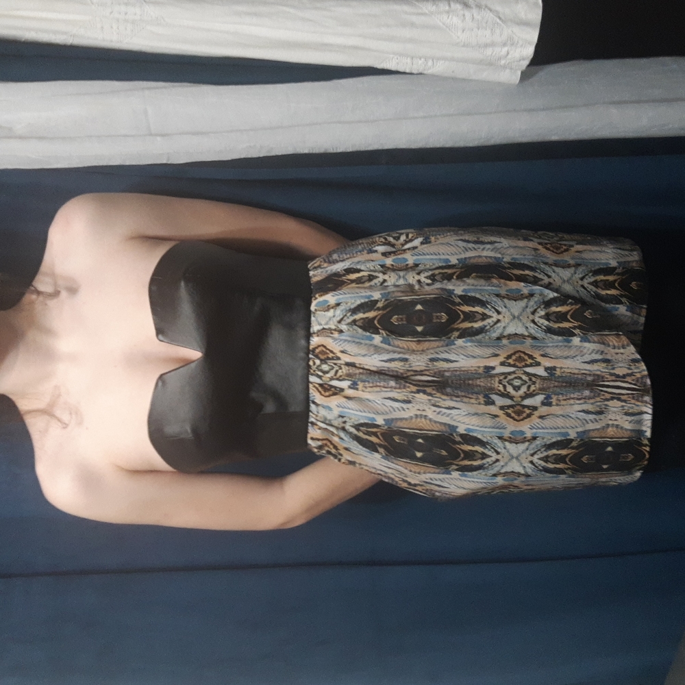 Black leather boned bousties, beacon stricter print skirt. Edgy and elegant.